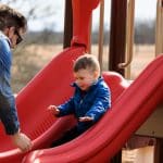woolaroc father and son on slide woolaroc father and son on slide